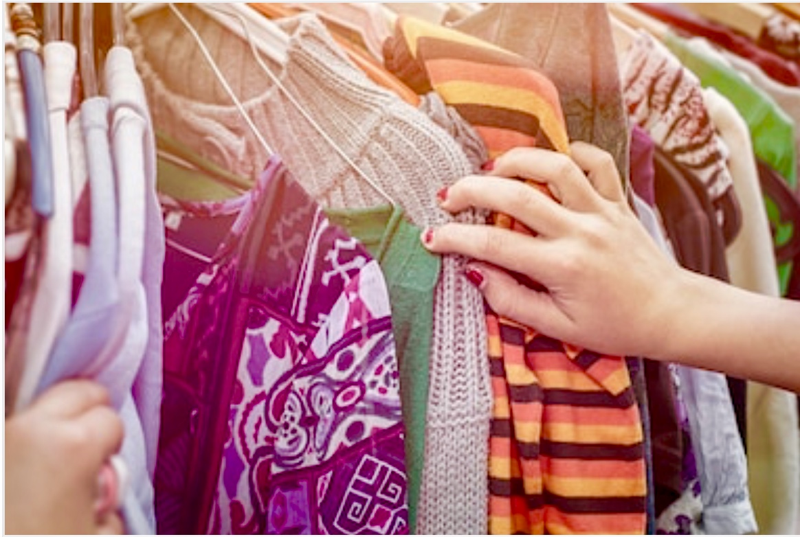 image of a clothing rack of beautiful and colorful womens clothes